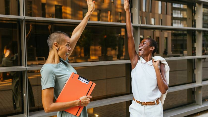 Joyful businesswomen celebrating success outdoors